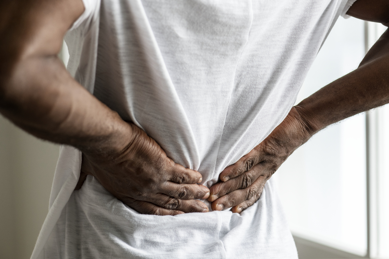 man suffering back pain