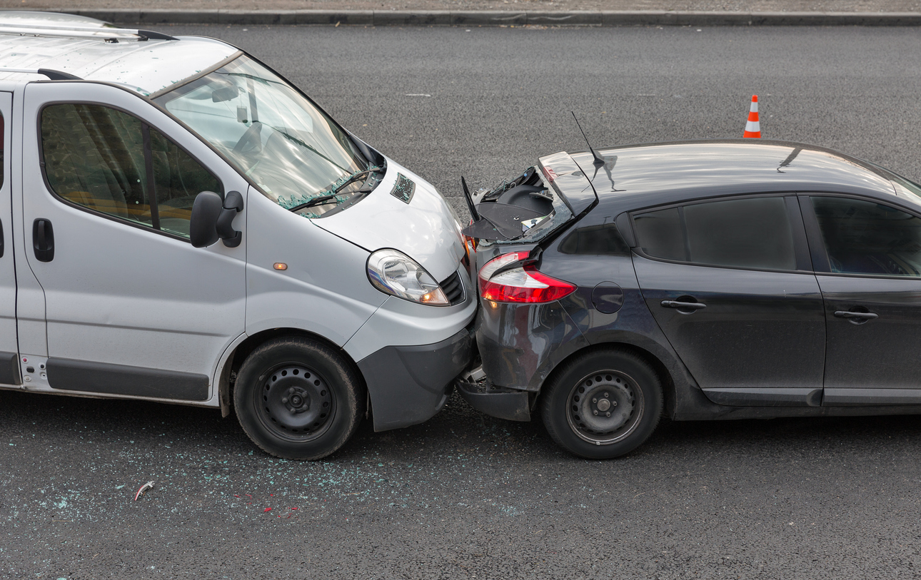 Auto accident involving two cars on a city street